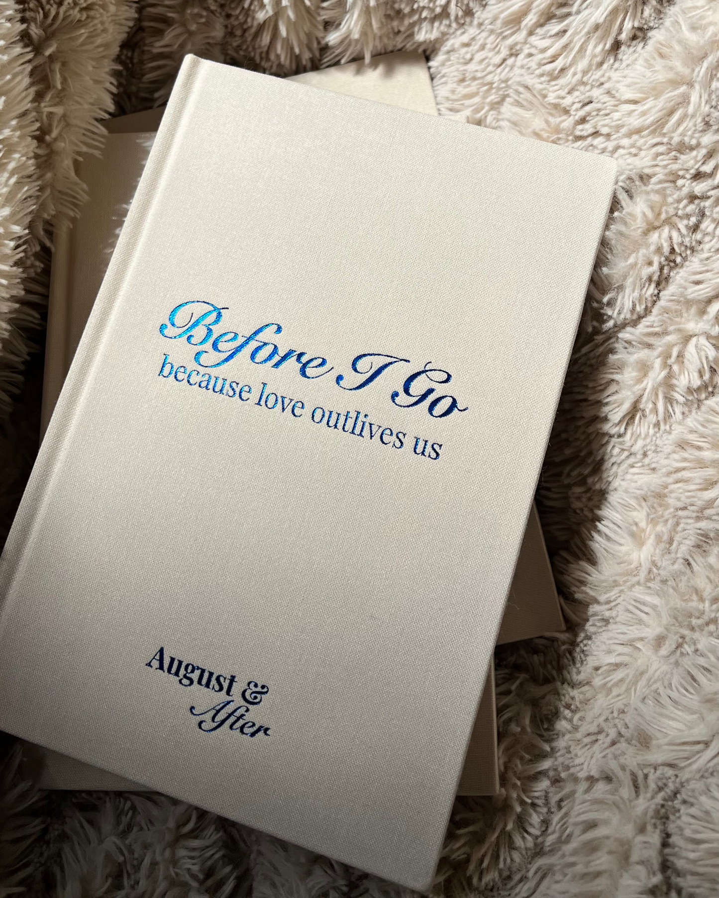 Book titled 'Before I Go because love outlives us' by August & After on a textured surface.